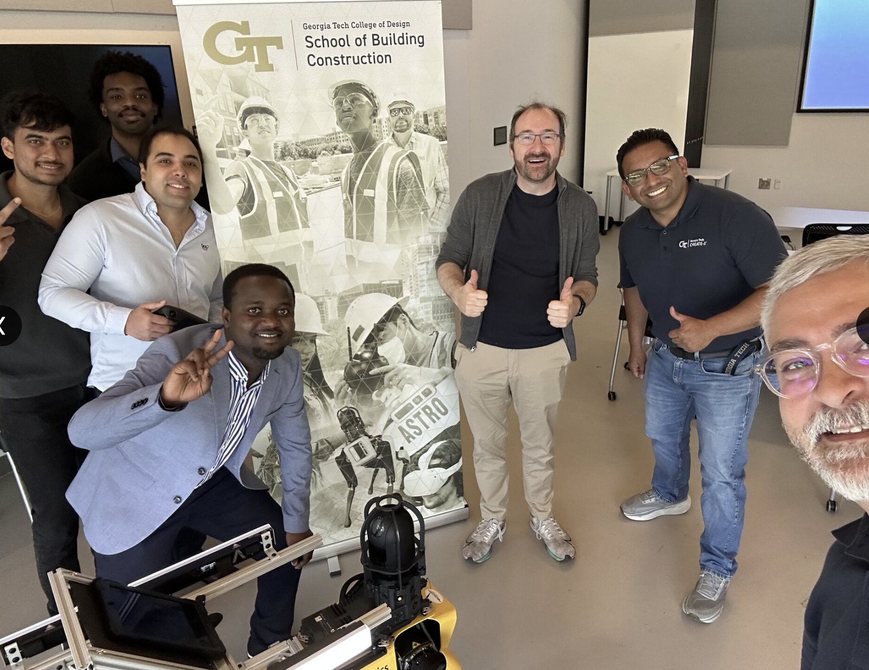 The venture team with the quadruped platform at the public close of the program